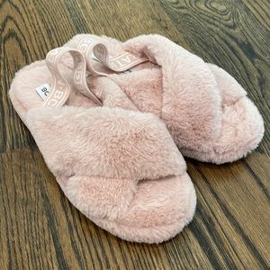 Faux fur pink slippers by BCBG